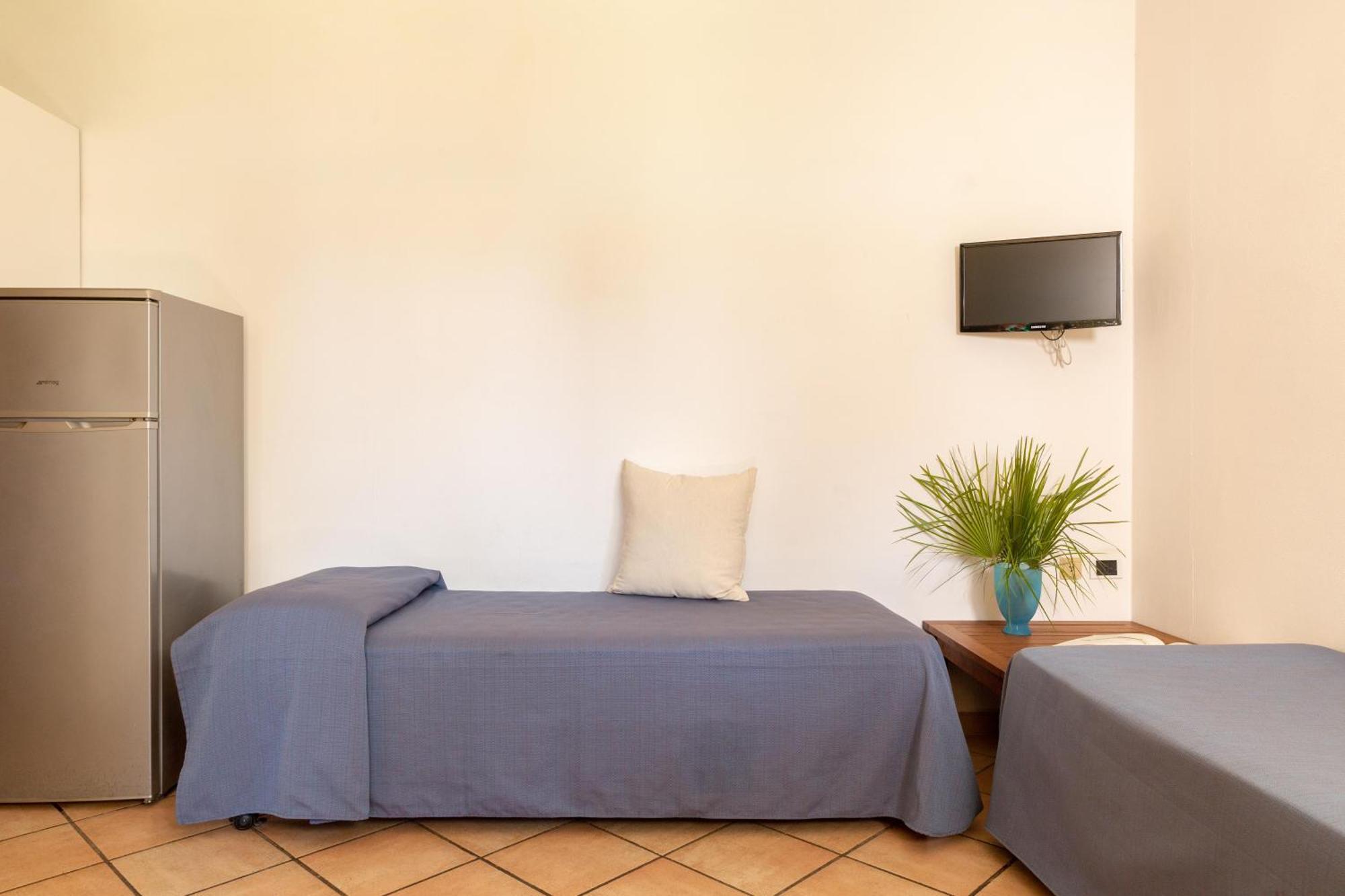 Gitavillage Argentario Albinia Exterior foto A typical room at the hostel